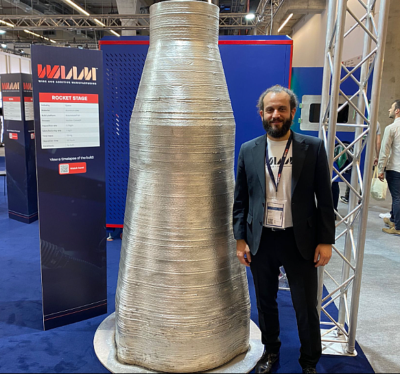 WAAM3D CEO Filomeno Martina showcasing large scale part created using RoboWAAM XP. Photo via 3D Printing Industry.