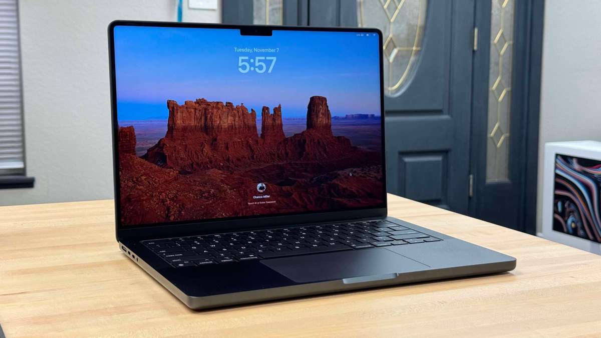 a laptop computer sitting on top of a table