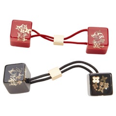 LOUIS VUITTON 2X gold tone LV monogram floral charm hair cube red black