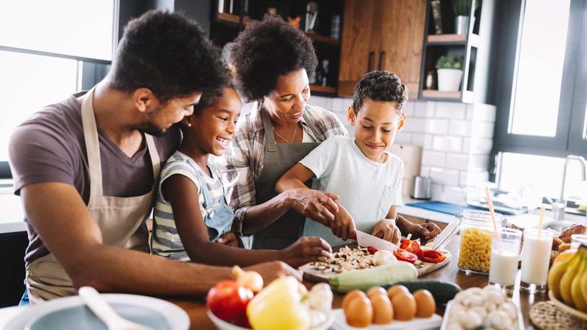 cracking egg trend family in kitchen