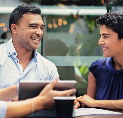 man and woman talking outside