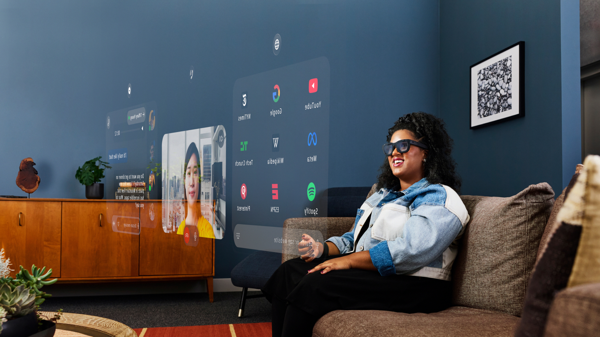 Woman wearing Orion glasses and looking at a holographic screen