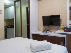 Compact Studio Room at Tamansari Papilio Apartment