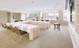 a large conference room with multiple tables and chairs , all set up for a meeting or event at Stamford Plaza Brisbane