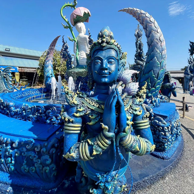 The Enchanting Blues of Chiang Rai: A Day at Wat Rong Suea Ten