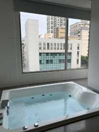 Room with a large jacuzzi🛁