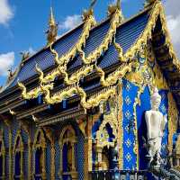 The Enchanting Blues of Chiang Rai: A Day at Wat Rong Suea Ten