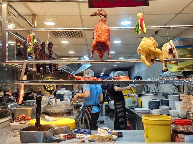 A restaurant serving hearty meals of porridge and Chinese barbecue