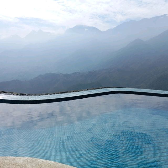 Awesome infinity pool with train passing by in Sapa: Viettrekking Hotel