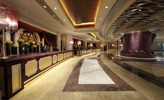 A spacious ground floor room features an elaborate ceiling and marble countertops at Studio City Hotel