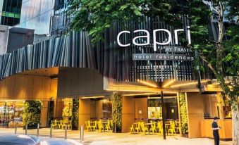 "a modern building with a large sign that reads "" capri hotel residences "" prominently displayed on the front of the building" at Capri by Fraser Brisbane