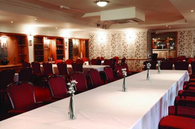 a conference room set up for a meeting , with multiple tables and chairs arranged in rows at Best Western Bradford Guide Post Hotel Best Western Bradford Guide Post Hotel Photo