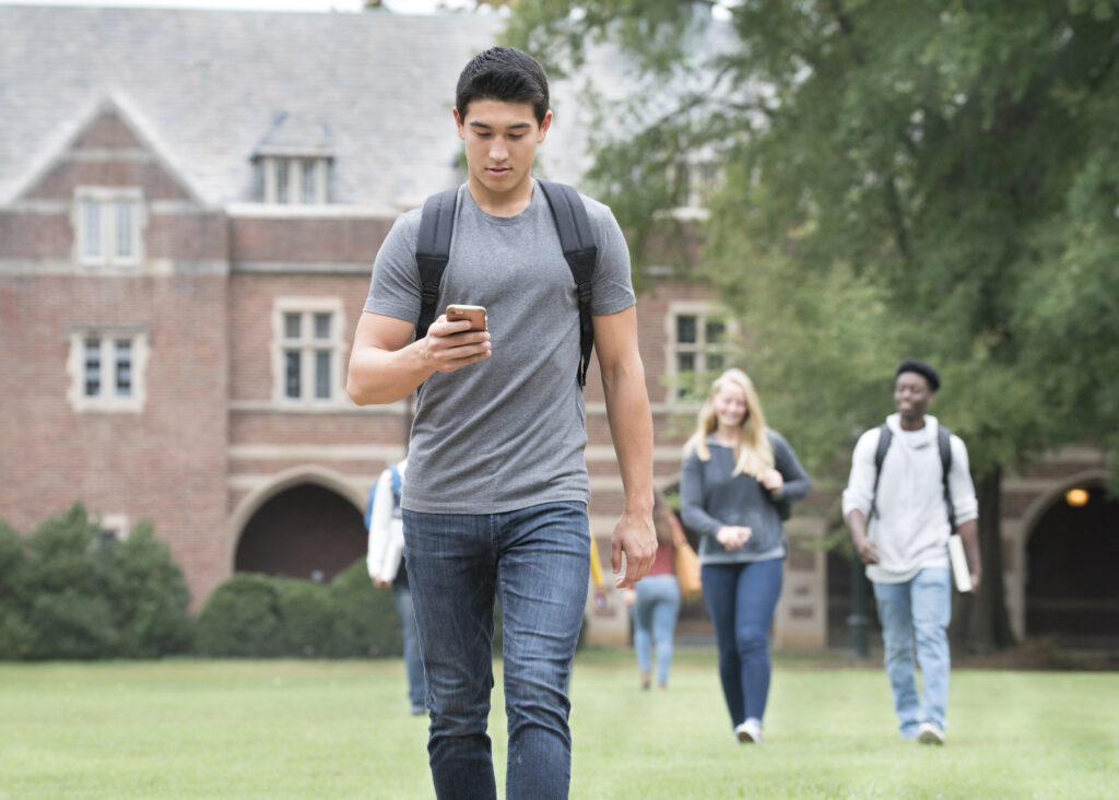 A student texts on a cellphone in this stock photo. (Photo by Ariel Skelley/Getty Images)