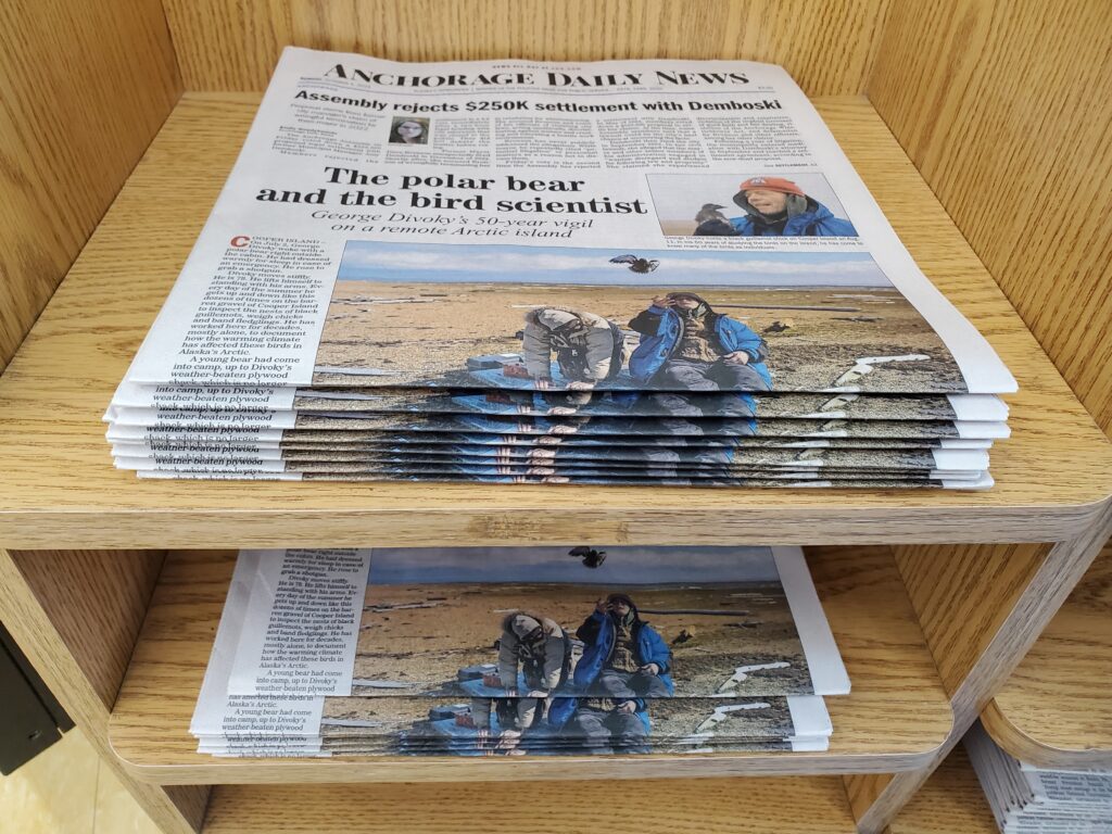 The print edition of the Anchorage Daily News is stacked at a stand at New Sagaya City Market in Anchorage on Oct. 7, 2024. (Photo by Yereth Rosen/Alaska Beacon)