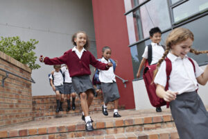 Students run down a school's steps. (Getty Images)