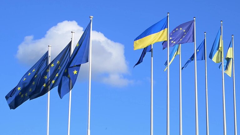 3 years anniversary of Russian aggression against Ukraine: Ukrainian and EU flags in front of the European Parliament in Brussels and Strasbourg