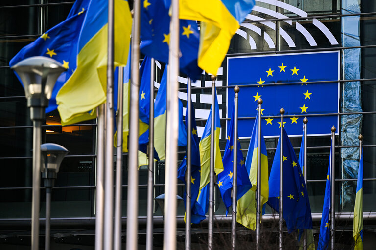 3 years anniversary of Russian aggression against Ukraine: Ukrainian and EU flags in front of the European Parliament in Brussels and Strasbourg