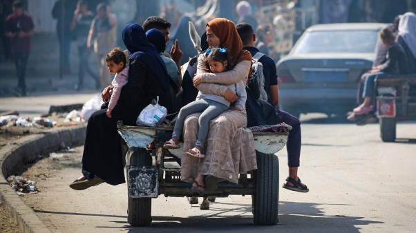 Displaced Palestinians travel on a cart in Rafah, southern Gaza Strip