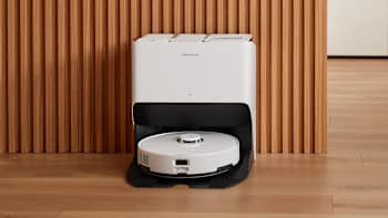 Roborock S8 Pro Ultra robotic vacuum in a charging dock on a hardwood floor