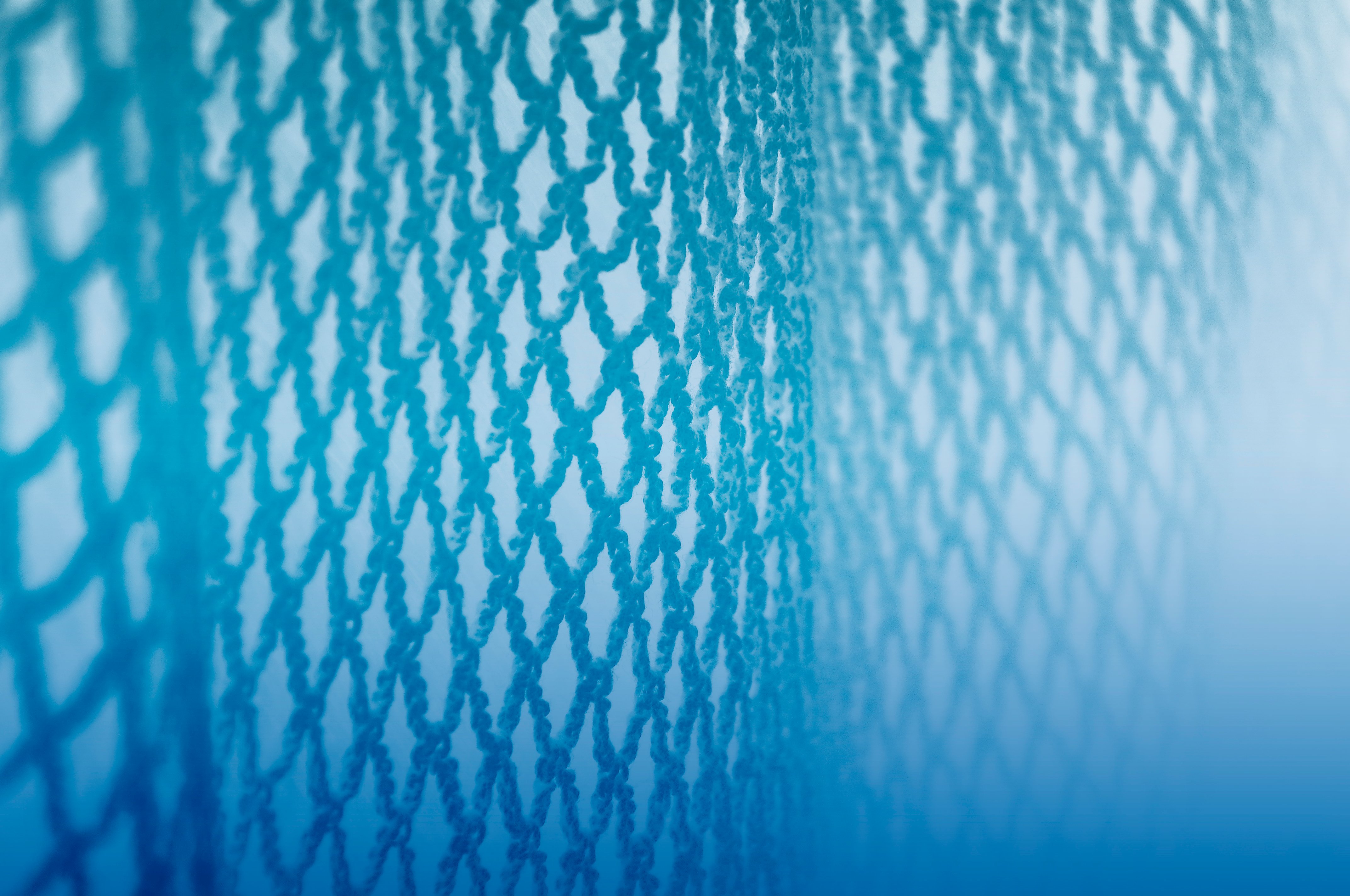 Abstract Underwater Blue Fishing Net