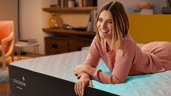 Woman laying on Cocoon mattress showing cooling cover