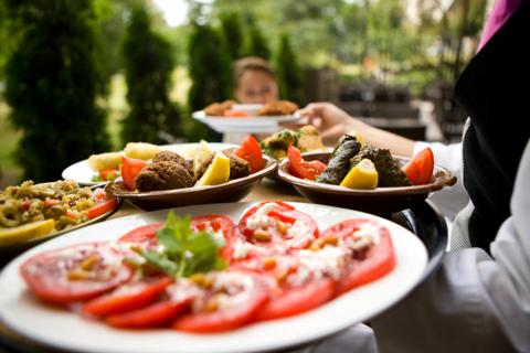 A server carries a platter full of nutritious foods