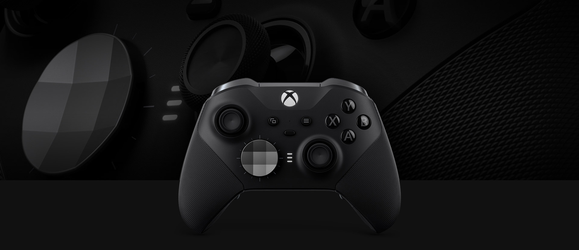 Front view of the Xbox Elite Wireless controller series 2 with a close up of the controller in the background