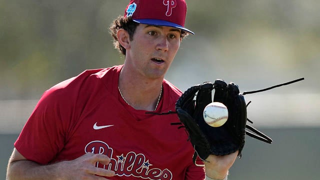 Phillies pitcher Andrew Painter catches a ball during a spring training workout in 2023 