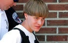 Police lead suspected shooter Dylann Roof into the courthouse in Shelby, North Carolina, on June 18, 2015. 