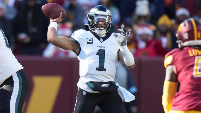 Jalen Hurts prepares to throw the ball during an NFL game at the Washington Commanders 