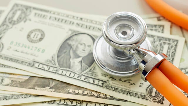 Close-up of American Dollar banknotes with stethoscope 