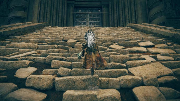A warrior ascends a large stone staircase in Shadow of the Erdtree
