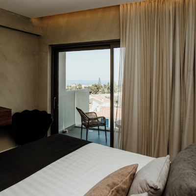 Superior Triple Room with Partial Sea View Cavo Zoe Seaside Hotel Promo Code