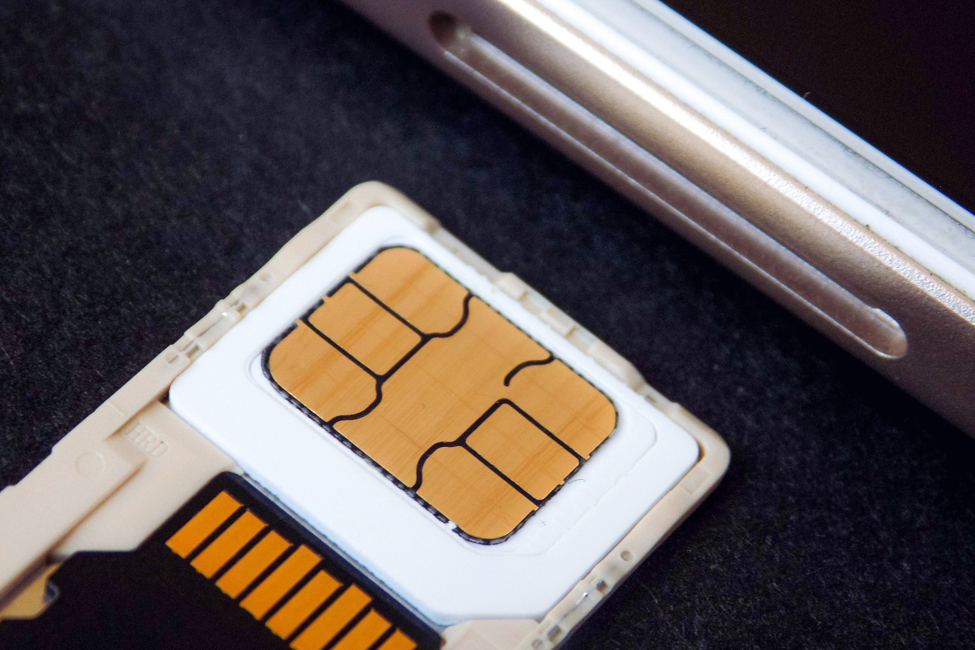 SIM Card next to a cell phone SIM slot