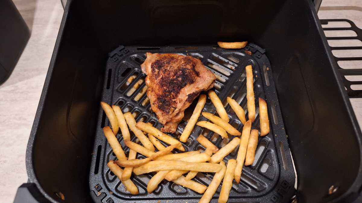 A top view of a cooked chicken thigh in the Dreo ChefMaker Combi Cooker