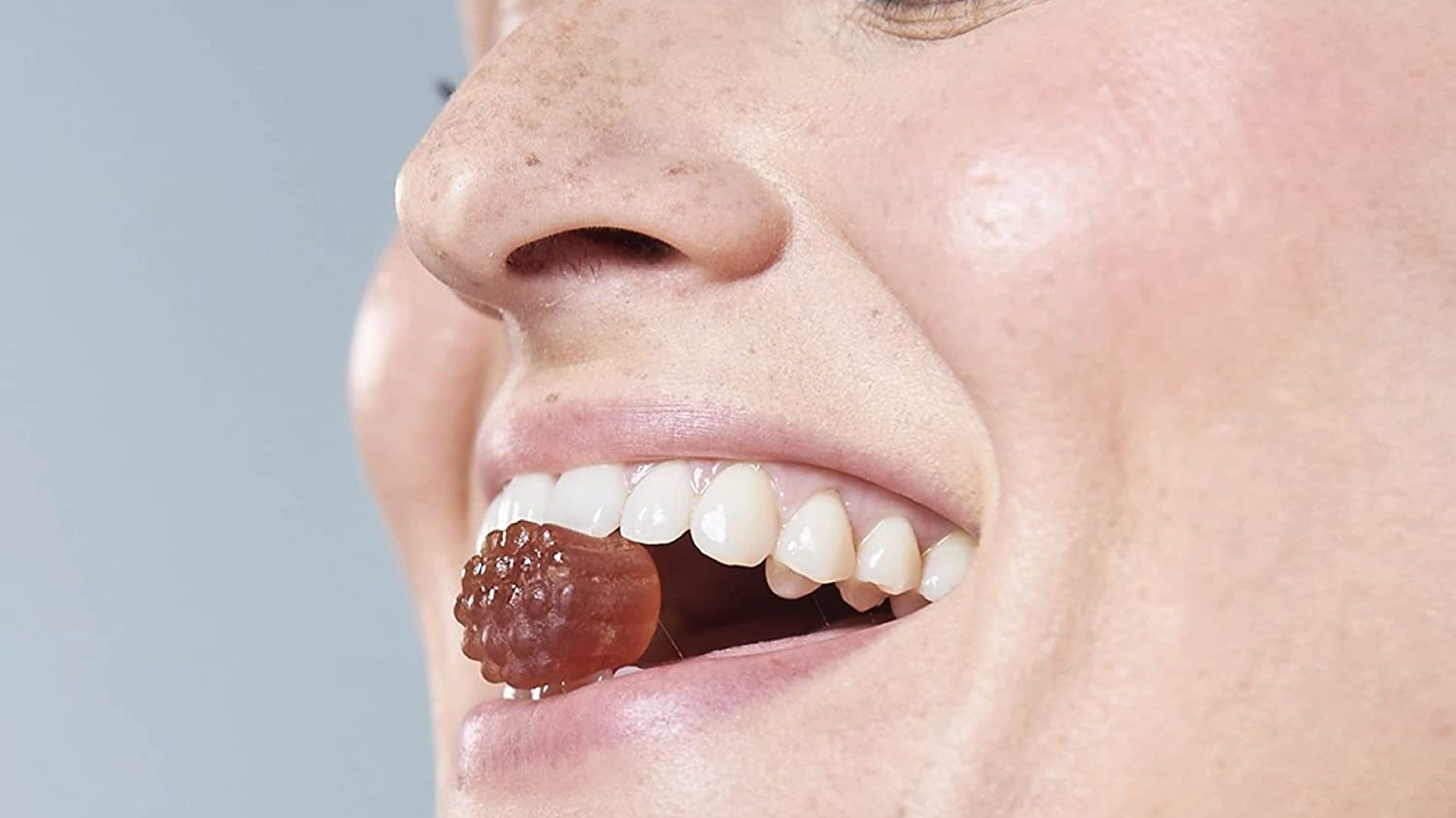 A woman enjoying a gummy