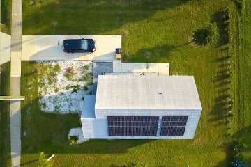 An EV is using the energy generated by solar panels.