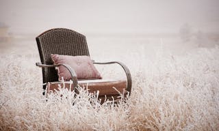 Vintage chair ona morning frost after a night of snow