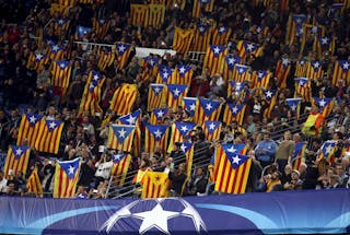 People raise "Estelada" flags (Catalan separatist flag) before Champions League group E soccer match between Barcelona and Bate 