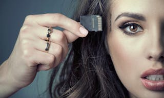 Beautiful woman inserting card into her head