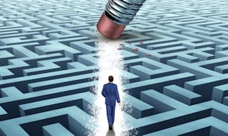 Leadership Solutions with a businessman walking through a complicated maze opened up by a pencil eraser as a business concept of