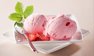 Strawberry ice cream with fruits close up