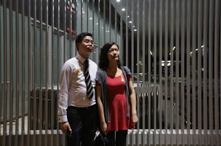 Terrence Tang and Jacqueline Cheung pose at a rally ahead of an "Occupy Central" civil disobedience protest in Hong Kong