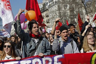 French high school and university students take part in a demonstration against the labour reform bill proposal in Paris