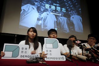 Committee members of Demosisto, including student leaders Joshua Wong and Agnes Chow, attend the launching ceremony of their new