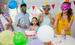 Happy multigeneration family celebrating birthday party at home