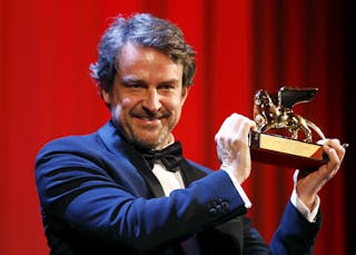 Director Lorenzo Vigas holds the Golden Lion prize for his movie "Desde Alla" during the award ceremony at the 72nd Venice Film 