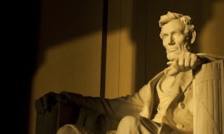 Statue of Abraham Lincoln in brilliant warm morning dramatic sunlight