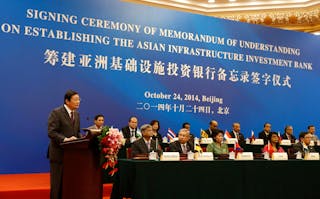 China's Finance Minister Lou Jiwei gives a speech with the guests of the signing ceremony of the Asian Infrastructure Investment