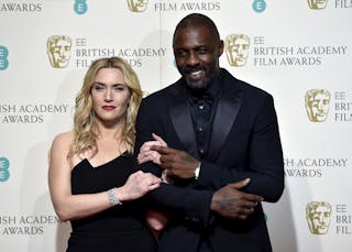 Idris Elba and Kate Winslet pose backstage at the British Academy of Film and Television Arts (BAFTA) Awards at the Royal Opera 